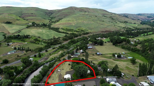 27406 Gem Ln, Juliaetta, ID 83535 - view of property location with property parcel outlined, rural landscape, and a mountain backdrop