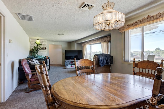 11360 W Lake Hazel Rd, Boise, ID 83709 - dining space featuring a textured ceiling, carpet floors, and a chandelier