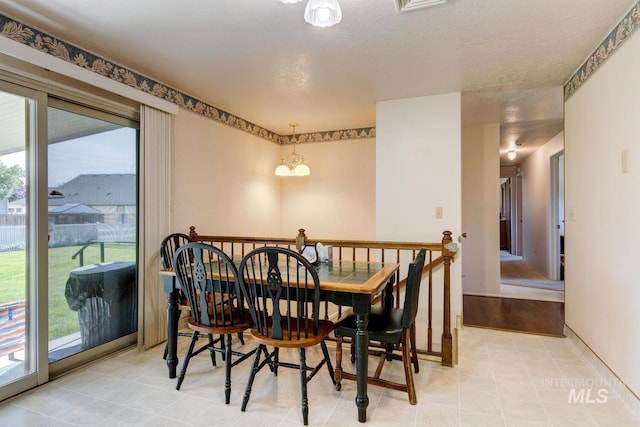 11360 W Lake Hazel Rd, Boise, ID 83709 - dining space with a chandelier and baseboards