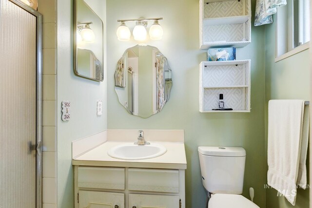 11360 W Lake Hazel Rd, Boise, ID 83709 - full bath with toilet, vanity, and an enclosed shower