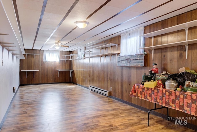 11360 W Lake Hazel Rd, Boise, ID 83709 - bar featuring wood walls, wood finished floors, a baseboard heating unit, and a ceiling fan