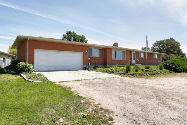 11360 W Lake Hazel Rd, Boise, ID 83709 - single story home with driveway, a garage, brick siding, and a chimney