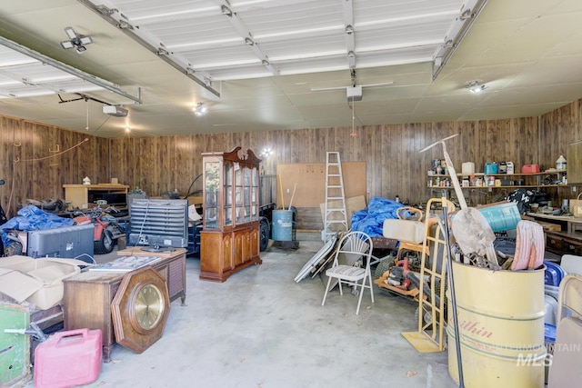 11360 W Lake Hazel Rd, Boise, ID 83709 - garage with wooden walls and a garage door opener