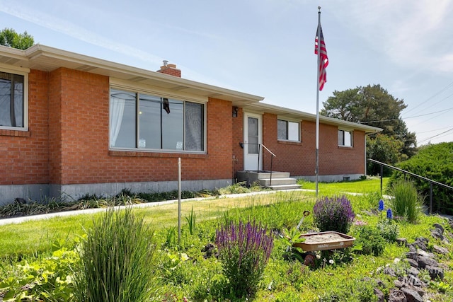 11360 W Lake Hazel Rd, Boise, ID 83709 - ranch-style home featuring brick siding and a chimney