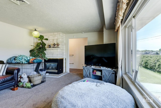 11360 W Lake Hazel Rd, Boise, ID 83709 - living area featuring healthy amount of natural light, carpet floors, a textured ceiling, and a fireplace