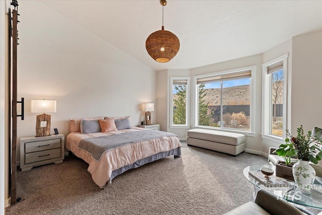 bedroom with carpet floors, lofted ceiling, and baseboards