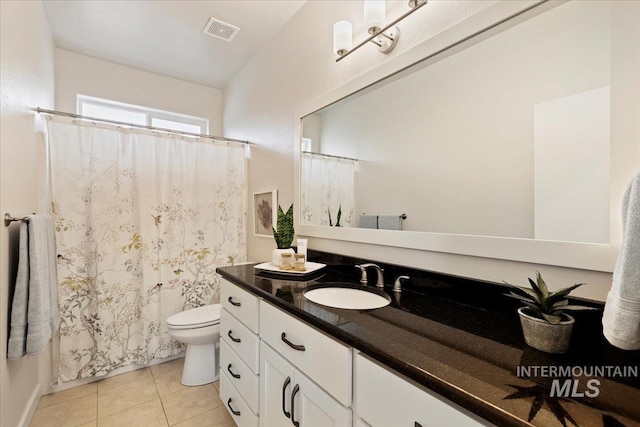 full bathroom featuring visible vents, a shower with shower curtain, toilet, tile patterned floors, and vanity