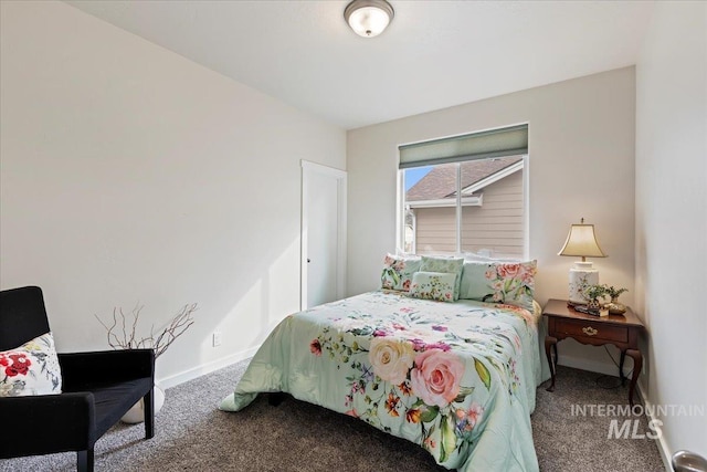 carpeted bedroom with baseboards