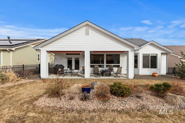 back of property featuring a patio, french doors, and fence