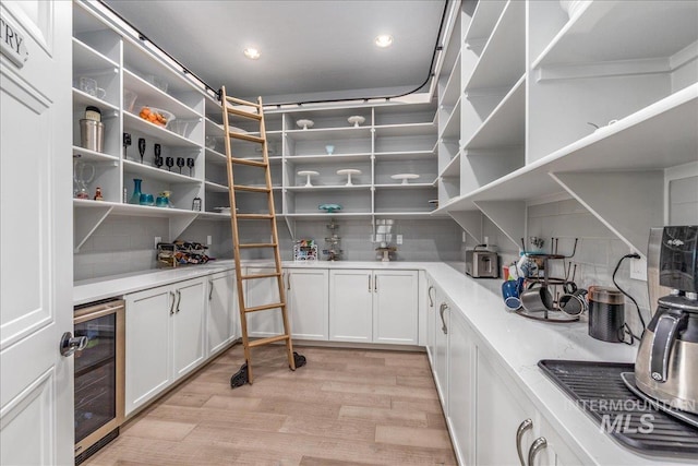 pantry featuring wine cooler