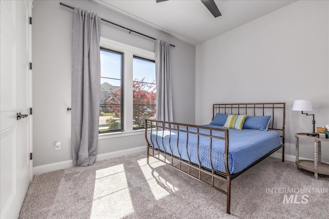 bedroom featuring ceiling fan and light colored carpet