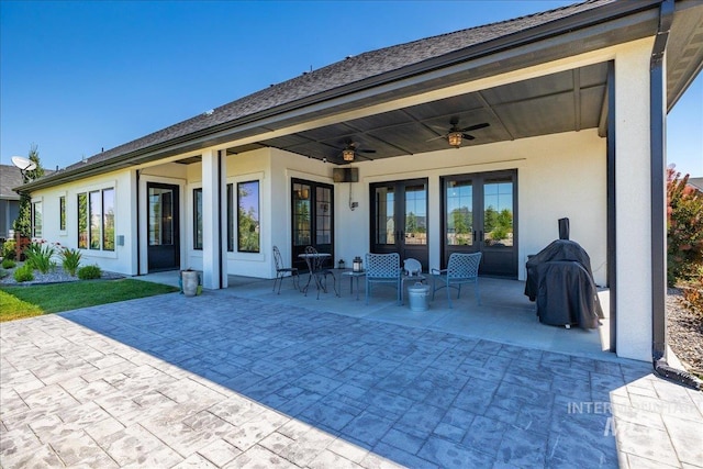 rear view of house with a patio area and ceiling fan