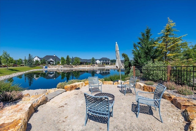 view of patio with a water view