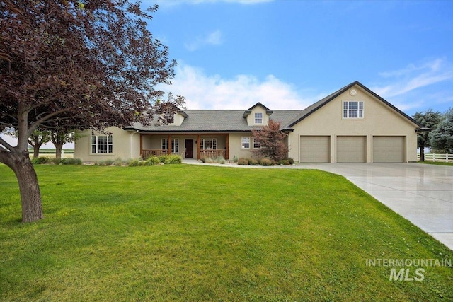 view of front of home featuring a front yard, covered porch, driveway, and stucco siding