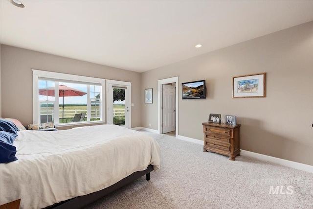 bedroom with carpet and baseboards