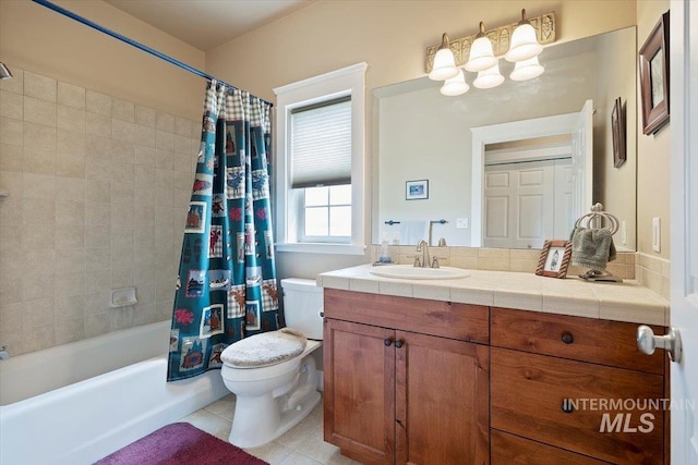 full bathroom featuring shower / bath combination with curtain, vanity, tile patterned flooring, and toilet