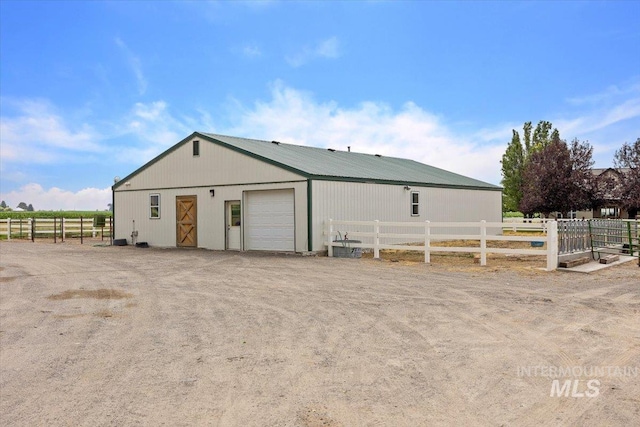 view of outbuilding featuring an outbuilding and fence