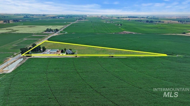 birds eye view of property with a rural view