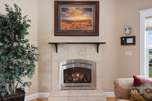 room details with a fireplace and baseboards