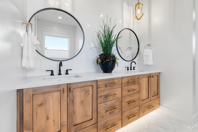 bathroom with double vanity, tasteful backsplash, and a sink