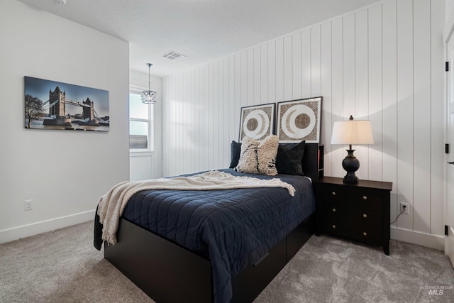 bedroom featuring carpet flooring, baseboards, and visible vents