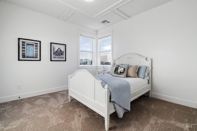 carpeted bedroom with visible vents and baseboards