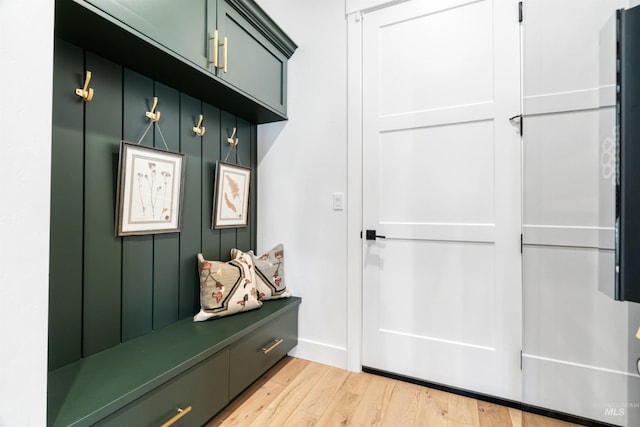 mudroom with light wood-style floors