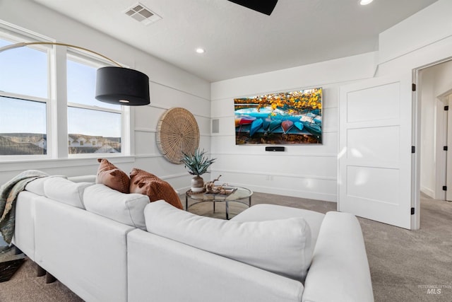 living room with recessed lighting, carpet, and visible vents