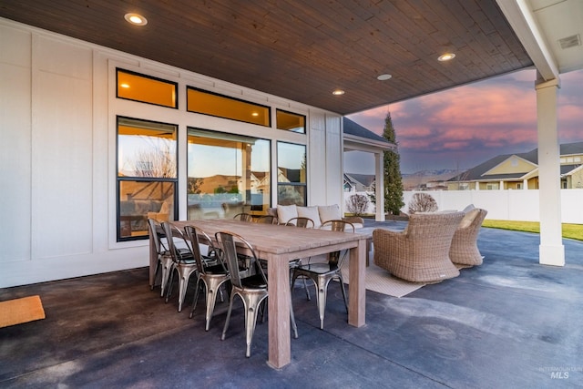 view of patio / terrace with outdoor dining space and fence