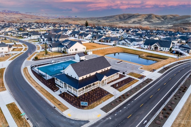 bird's eye view featuring a residential view and a mountain view