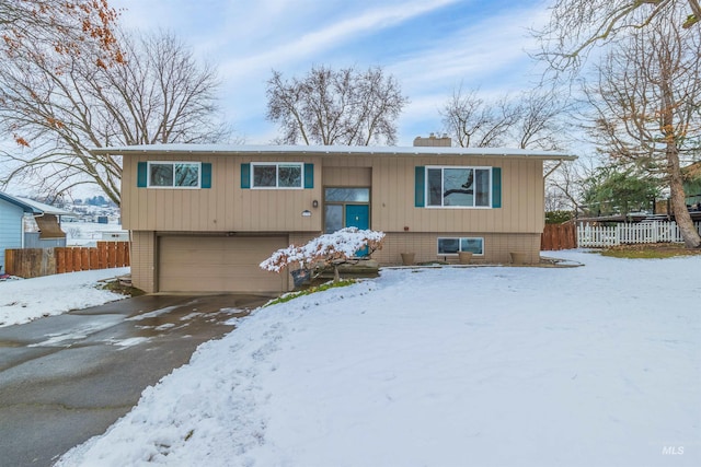 split foyer home featuring a garage