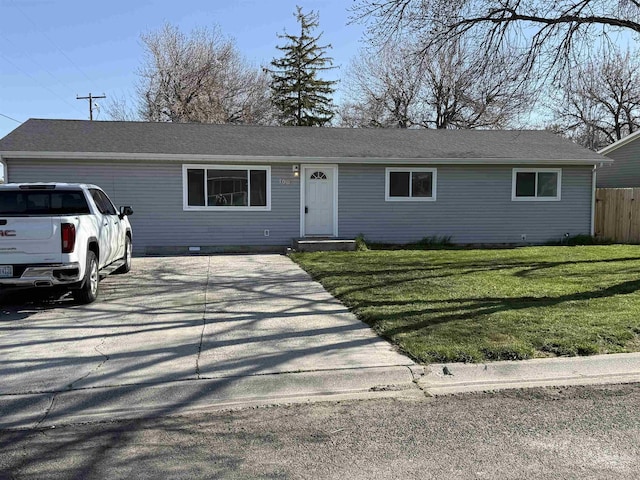 ranch-style house featuring a front yard, crawl space, and fence