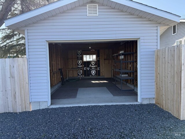 garage featuring fence