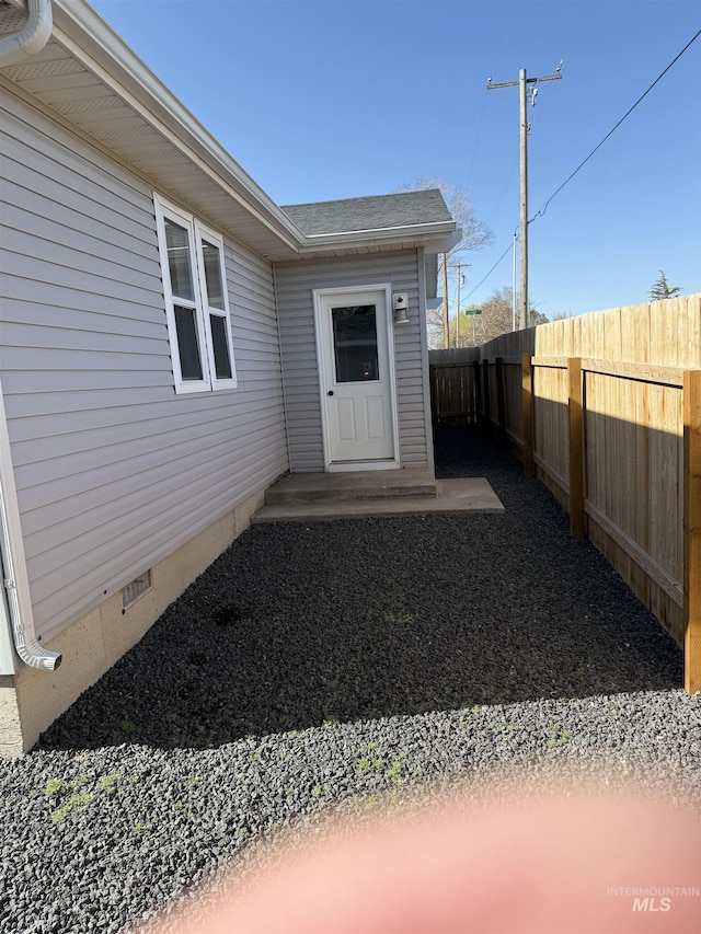 property entrance featuring fence