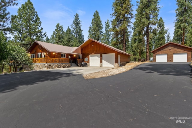 view of front of property with a detached garage