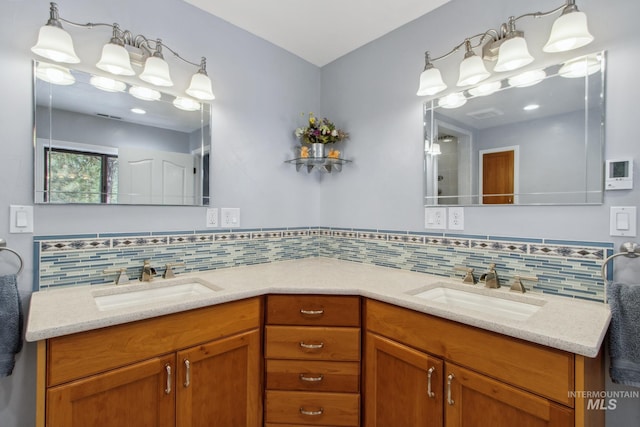 full bath featuring double vanity, decorative backsplash, and a sink