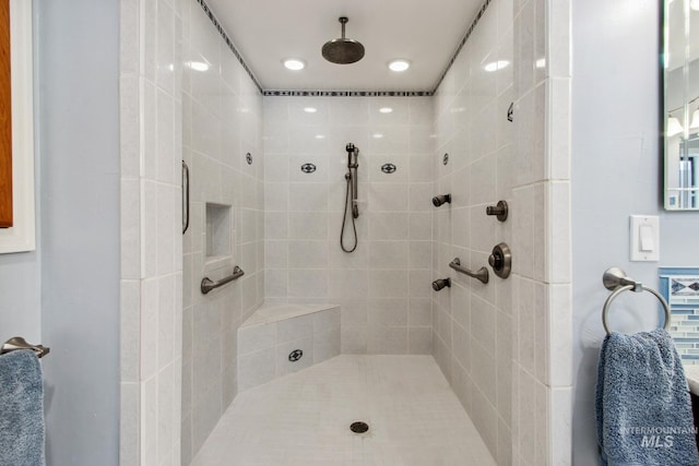 full bathroom with tiled shower