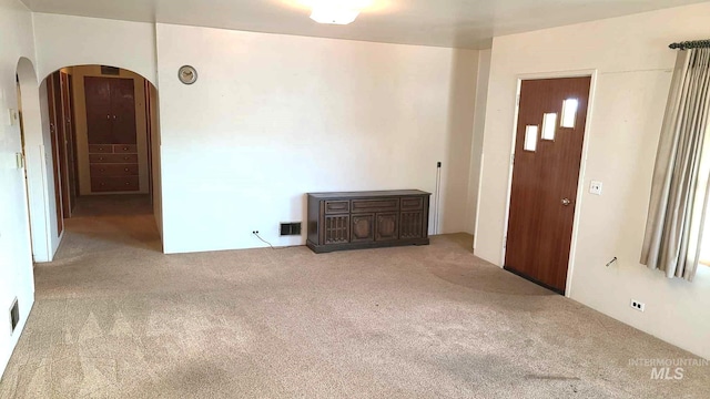 1120 N State St, Grangeville, ID 83530 - empty room featuring carpet flooring and arched walkways