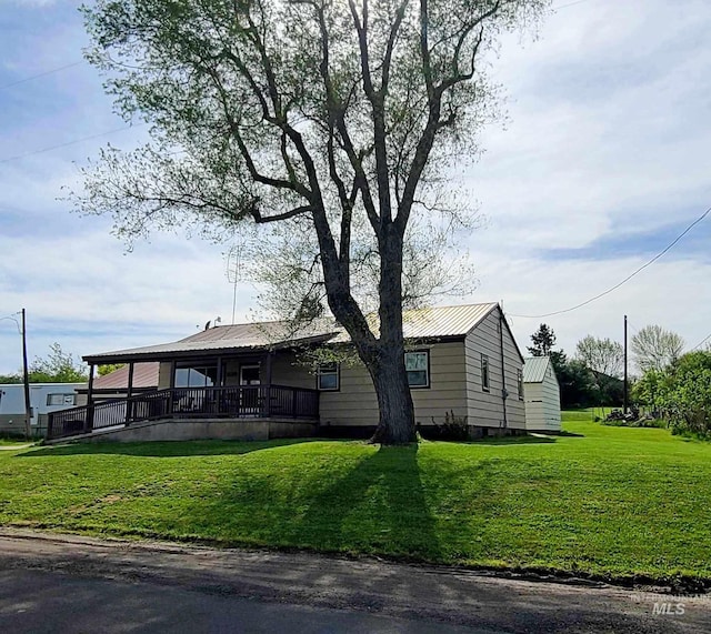 1120 N State St, Grangeville, ID 83530 - view of front facade featuring a front lawn and metal roof