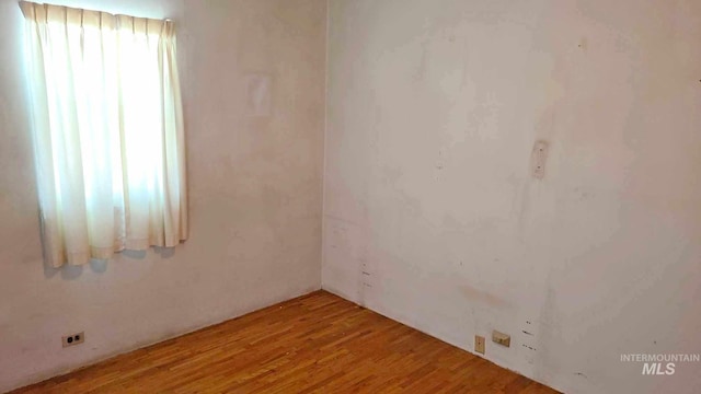 spare room featuring hardwood / wood-style floors