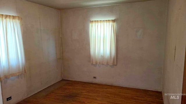 1120 N State St, Grangeville, ID 83530 - spare room with wood finished floors and plenty of natural light