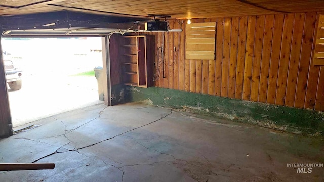 garage featuring wooden walls