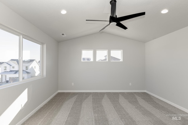 empty room featuring carpet flooring, a ceiling fan, visible vents, baseboards, and recessed lighting
