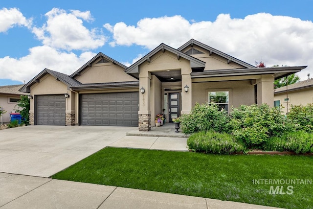 1833 N Monterossa, Eagle, ID 83616 - view of front of property with stucco siding, a garage, concrete driveway, a front yard, and stone siding