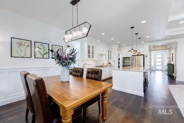 1833 N Monterossa, Eagle, ID 83616 - dining area featuring dark wood-style floors, a wainscoted wall, a decorative wall, and recessed lighting