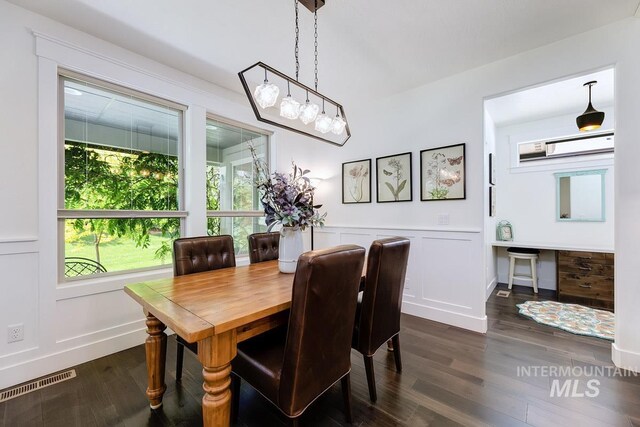 1833 N Monterossa, Eagle, ID 83616 - dining room featuring dark wood-type flooring, a decorative wall, a wainscoted wall, and baseboards