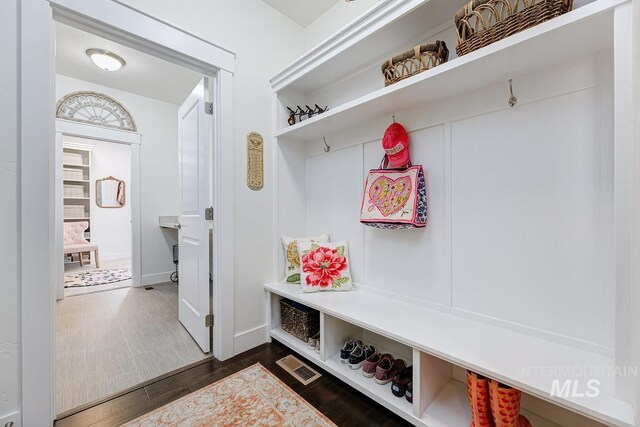 1833 N Monterossa, Eagle, ID 83616 - mudroom featuring dark wood-style flooring and baseboards