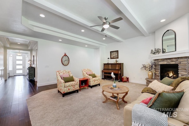 1833 N Monterossa, Eagle, ID 83616 - living room featuring a ceiling fan, baseboards, a stone fireplace, beam ceiling, and dark wood finished floors