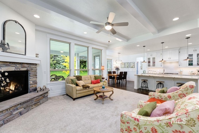1833 N Monterossa, Eagle, ID 83616 - living room featuring recessed lighting, beam ceiling, ceiling fan, a stone fireplace, and baseboards