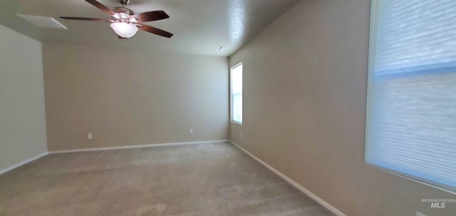 carpeted empty room featuring ceiling fan